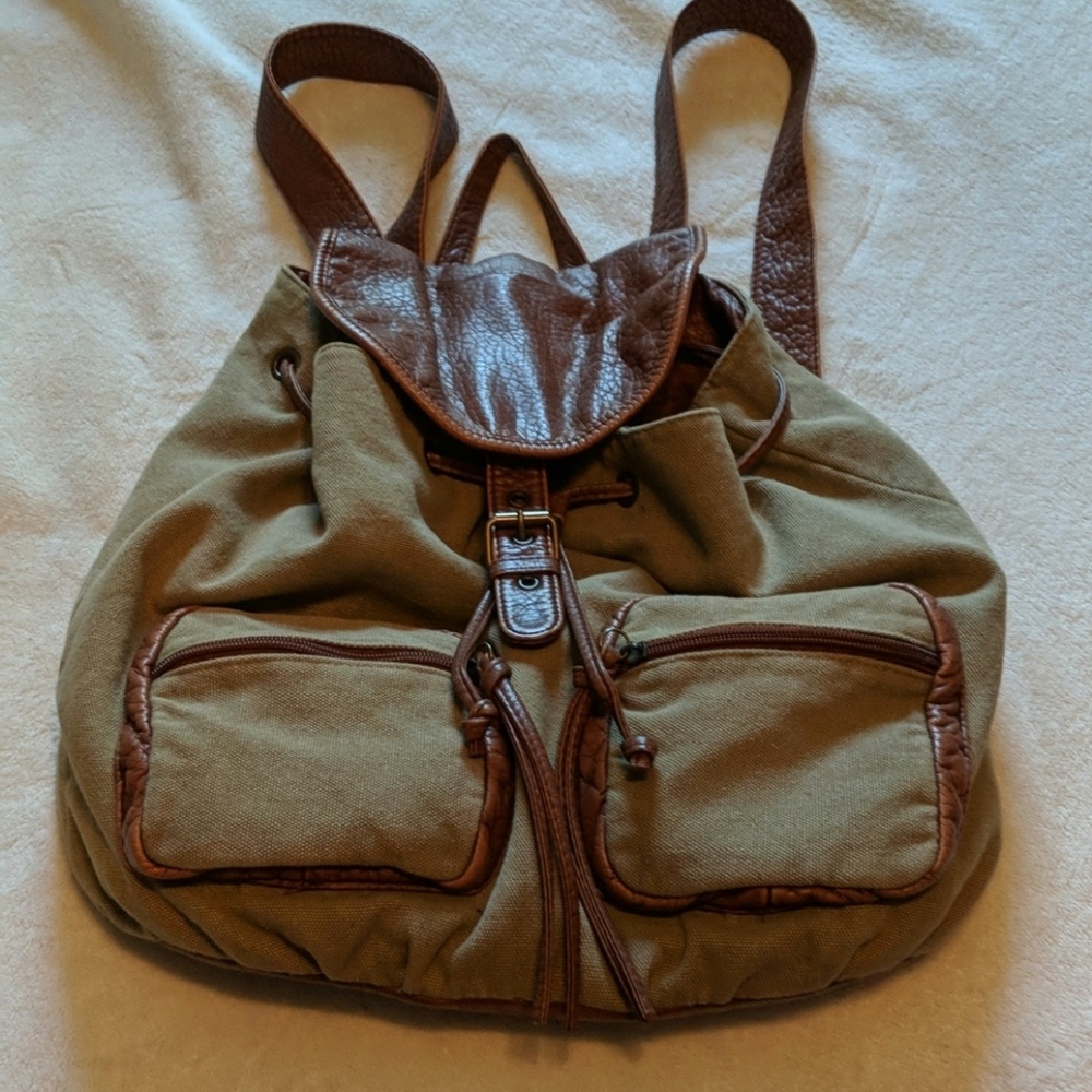 Canvas drawstring back pack.